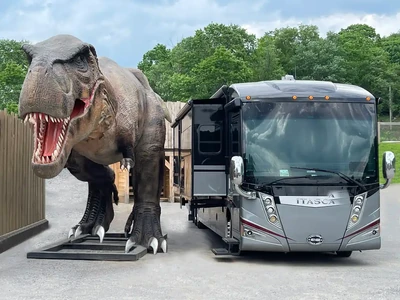 RV next to Dino statue